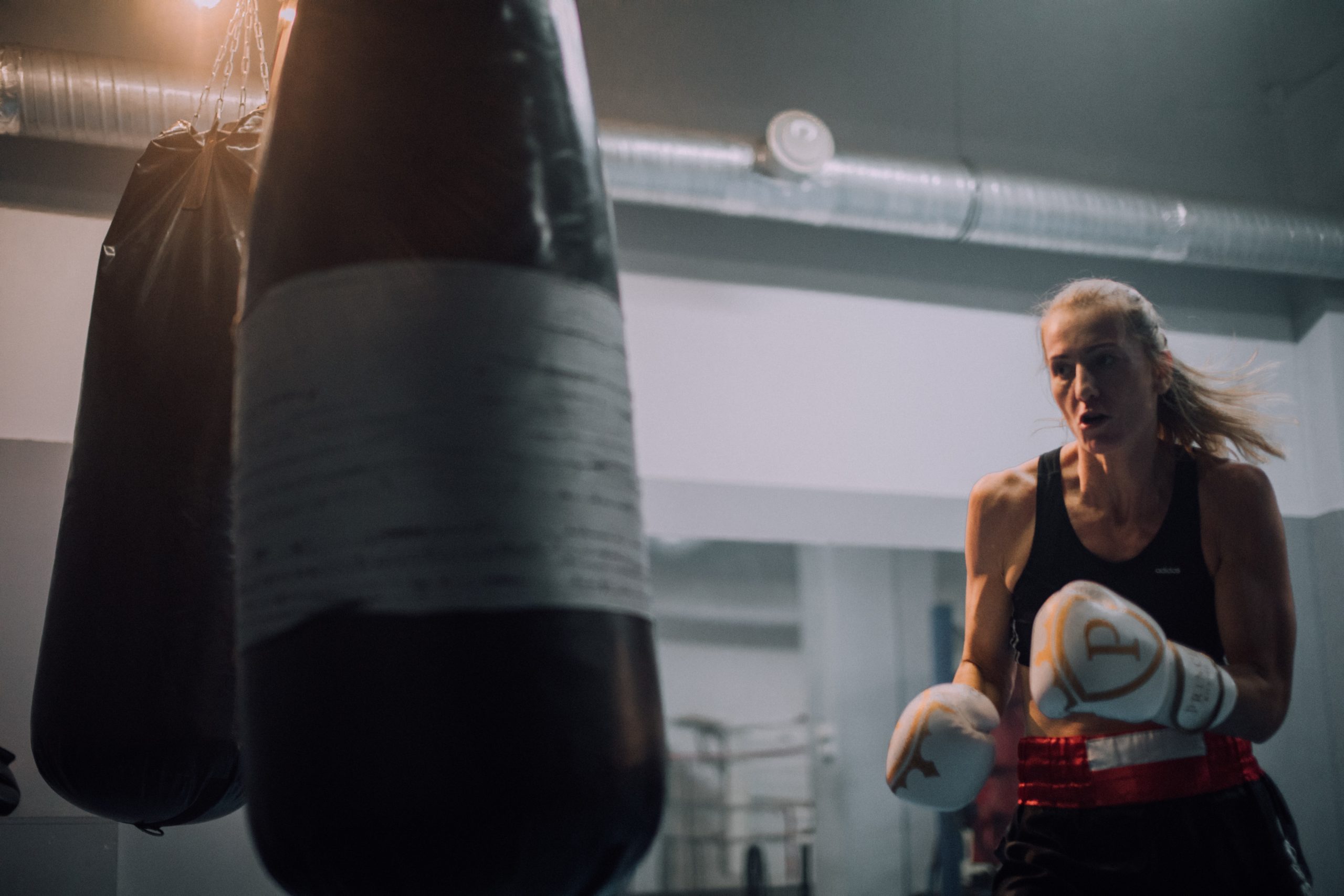 Woman hitting heavy bag